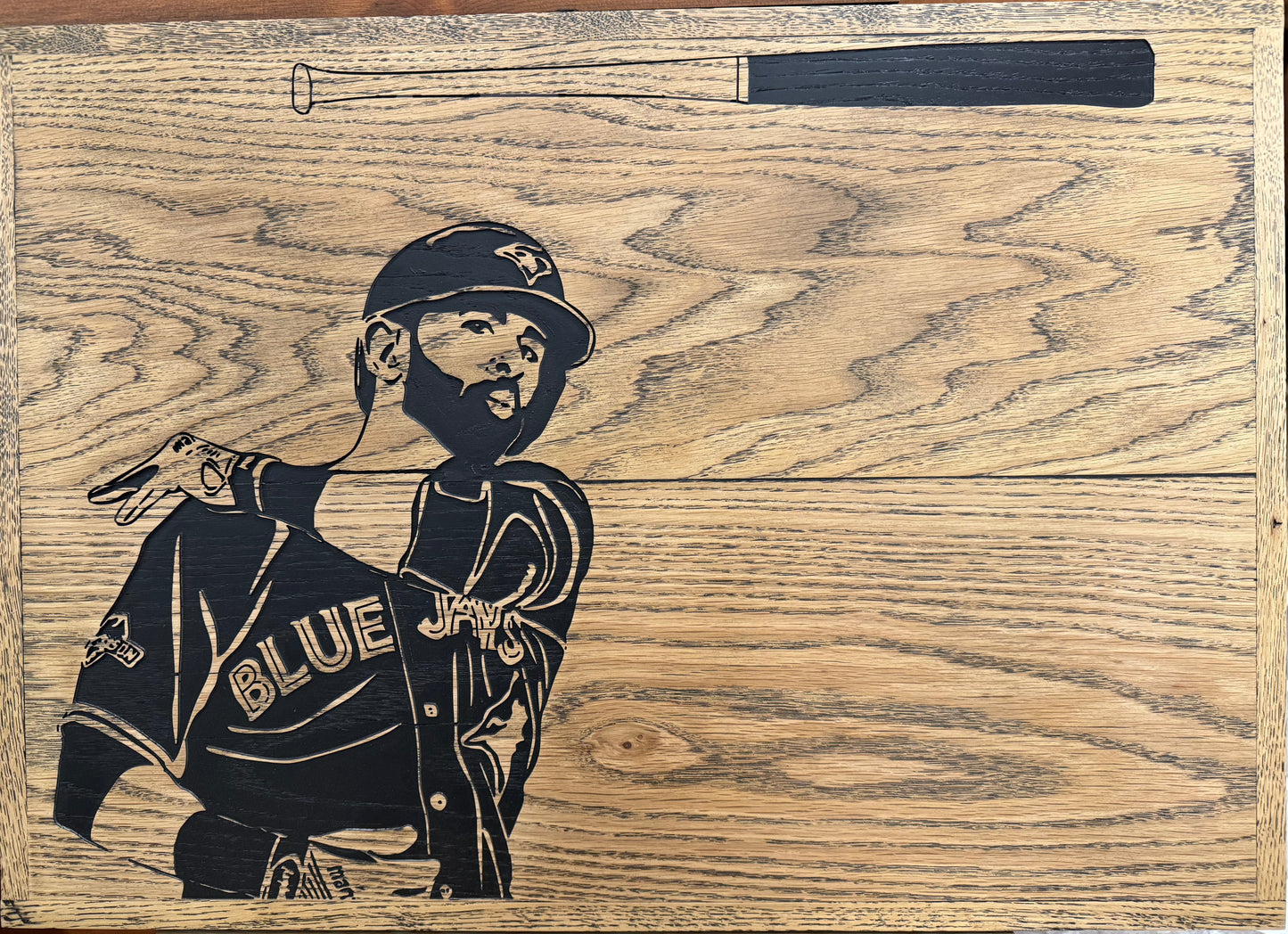 Wooden sign of Jose Bautista swinging his baseball bat in a Toronto Blue Jays jersey