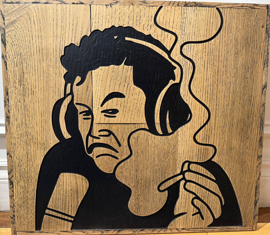 Wooden sign of Elon Musk with headphones on