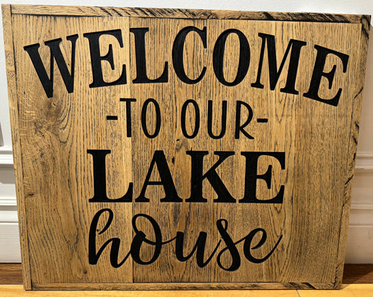 Wooden sign that says welcome to our lake house